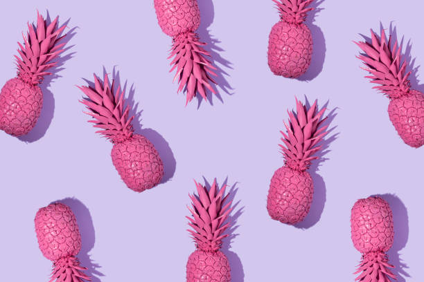 istock Creative pattern with bright pink painted pineapple on pastel purple background. Fruit art concept. Minimal food colorful idea. 1370874609