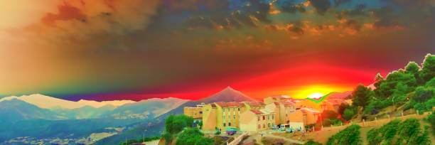 View from Lazharia village, over-edited photography with unreal colors, Unrealistic Highlights and shadows. Sunbeam, mountains, green trees, buildings, old vehicles and unrecognizable habitants.