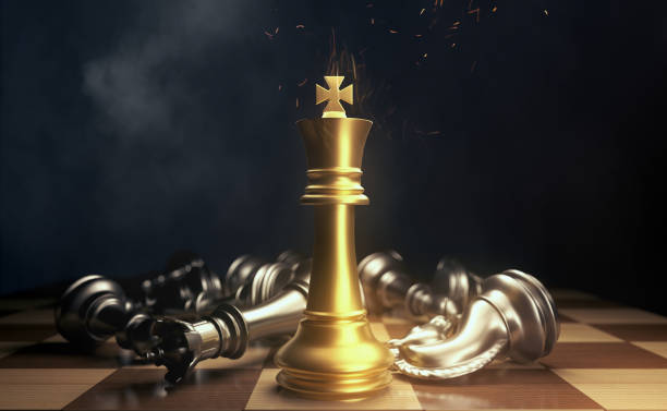 chess pieces.gold king winner surrounded with silver chess pieces on chess board game competition.concept strategy, leadership and success business. tense atmosphere. - chess king chess chess piece black imagens e fotografias de stock