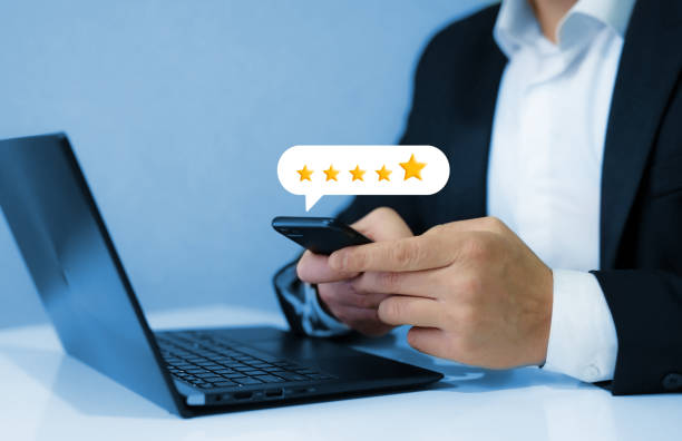 Gold five star rating feedback on virtual sreen. Concept of satisfaction, quality and performance. stock photo