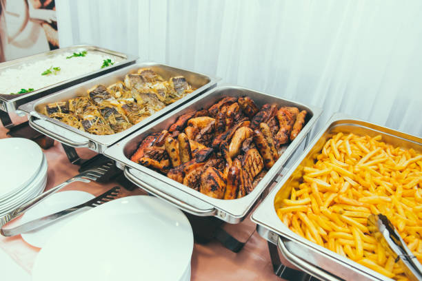 istock Cuisine Culinary Buffet Dinner Dining Food Celebration Party Concept. Trays with main meals - french fries chips, rice, meet and fish. Service at business meeting, weddings. Selective focus 1370876106