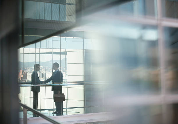 Businessmen shaking hands  selective focus stock pictures, royalty-free photos & images