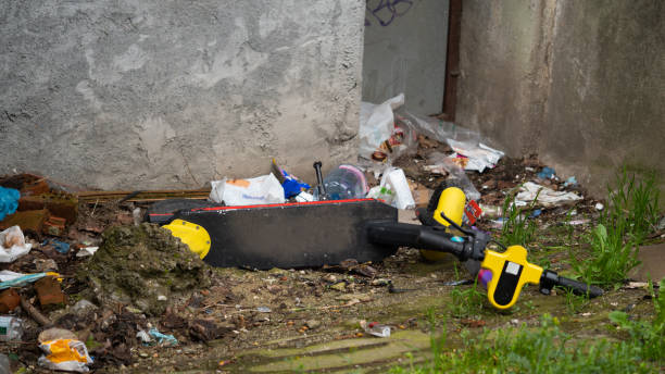 istock The electric scooter is thrown into the trash. 1370876816