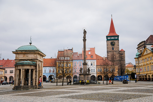Wallenstein square, renaissance historical buildings, baroque meteorological column, gothic tower Valdice gate and Marian Column, sculptural group of Virgin Mary, Jicin, Czech Republic, May 01, 2021