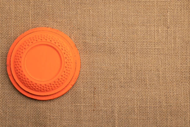 Clay shooting target on burlap background , Shotgun game