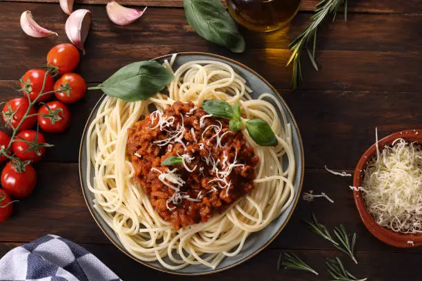 Italian Cuisine Spaghetti with Bolognese Sauce with grated cheese. High resolution image 45Mp using Canon EOS R5 and associate lens