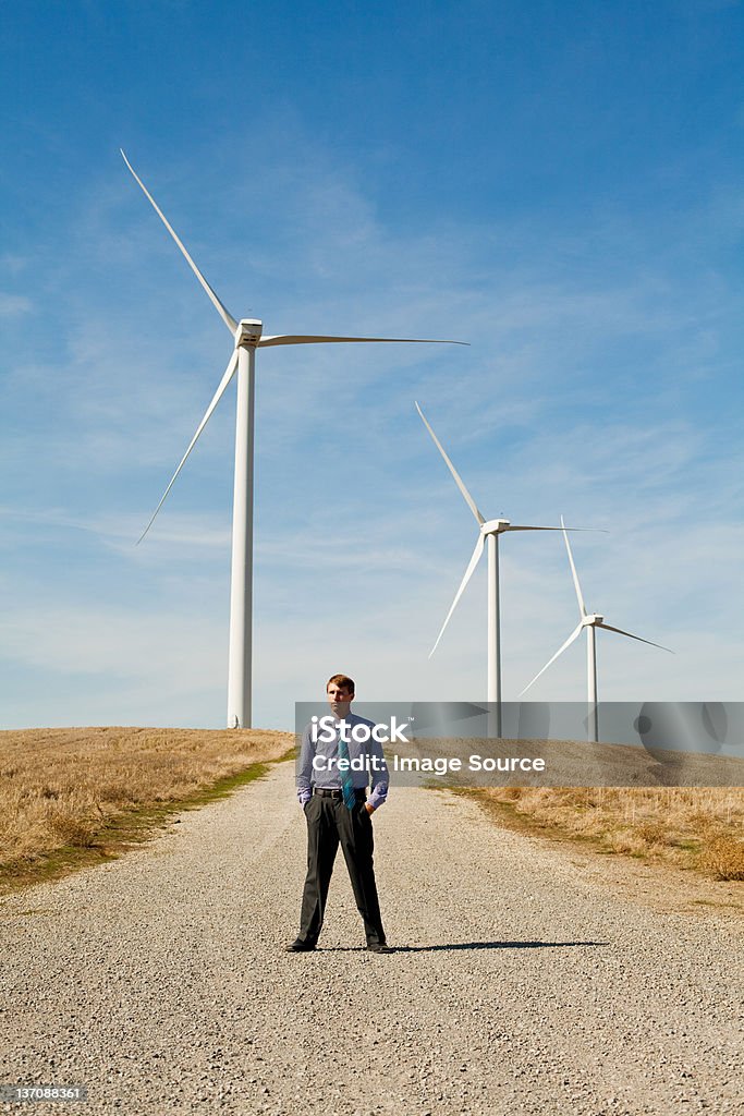 Man in front of wind turbines  Heroes Stock Photo