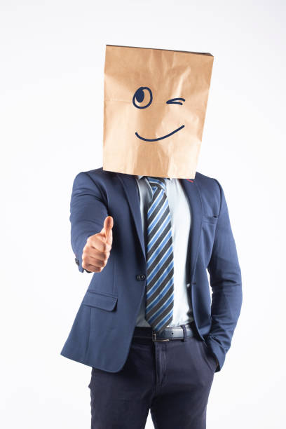istock Businessman with paper bag on head 1370885025