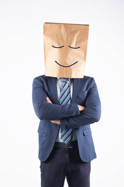 istock Businessman with paper bag on head 1370885065