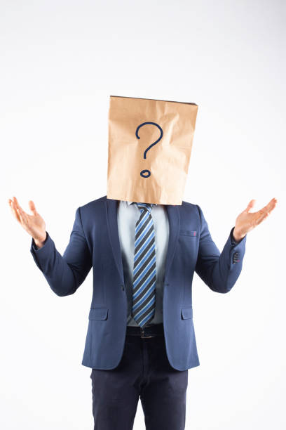 istock Businessman with paper bag on head 1370885193
