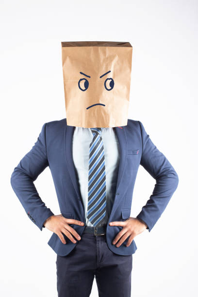 istock Businessman with paper bag on head 1370885358