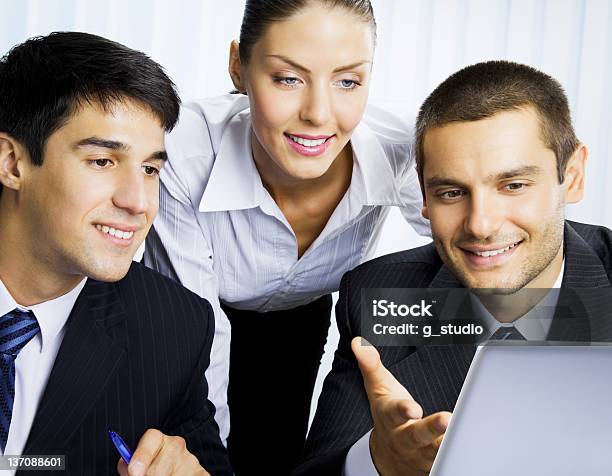 Businesspeople Working With Laptop At Office Stock Photo - Download Image Now - Adult, Asking, Business