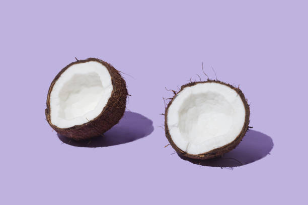 istock Fresh fruit, nut and seed concept. Organic lovely opened coconut head against very peri background 1370886626