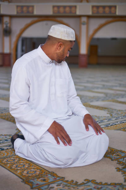 istock A Muslim man looks over his left shoulder in prayer 1370888216