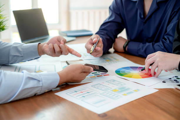 istock Teamwork designer ui ux brainstorm ideas about designing on mobile apps. 1370888366