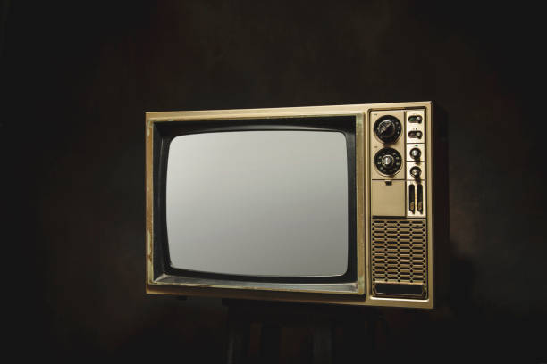istock Retro old TV on dark room background 1370889761