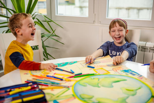 Adorable kids having lot of fun during art class Unrecognizable art teacher teaching the group of kids via art about sustainability and to take care of planet Earth cleft lip stock pictures, royalty-free photos & images