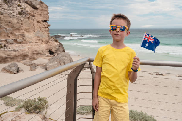 istock Boy holding Australian flag in his hand on Australia Day 1370892985