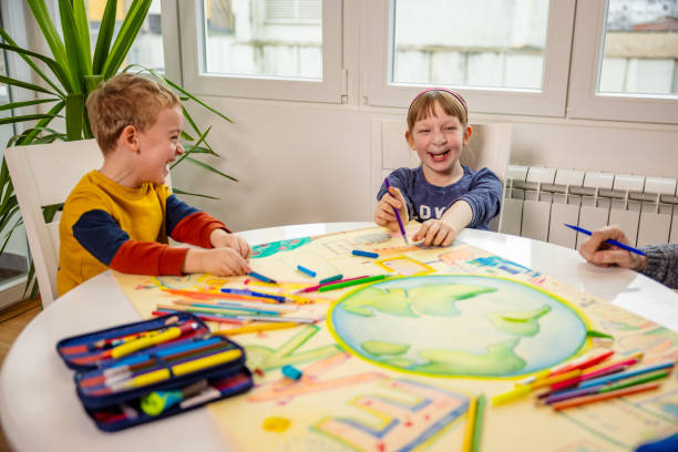 Adorable siblings having lot of fun during art class Unrecognizable art teacher teaching the group of kids via art about sustainability and to take care of planet Earth cleft lip stock pictures, royalty-free photos & images