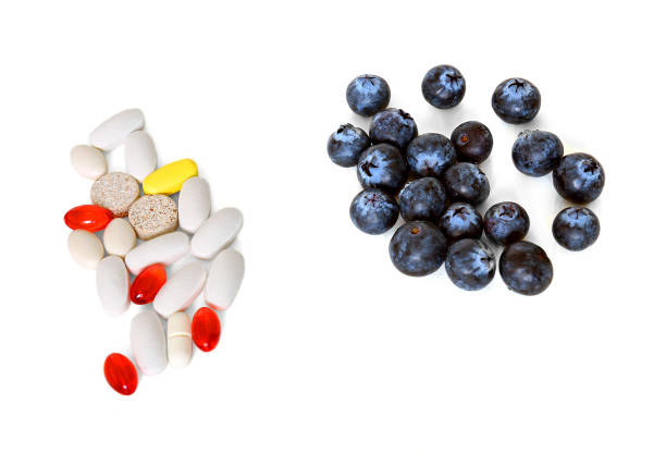 istock Choice: medical pills or vitamins in berries? 1370896183