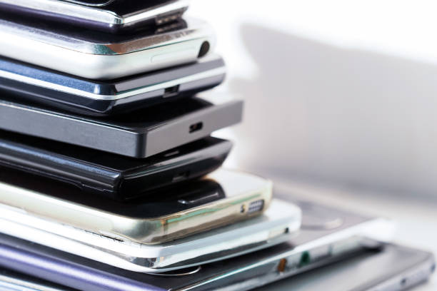 istock Stack of high-end smartphones on desk. Heap of modern electronic devices, technology concept 1370896519