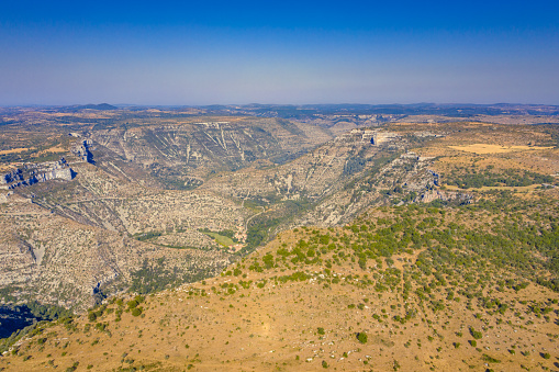 Aerial view of Grand Site of the Circus of Navacelles in Gorges La Vis in Cevennesof, Causse de Blandas limestone karst highland plateau in Occitanie, France.