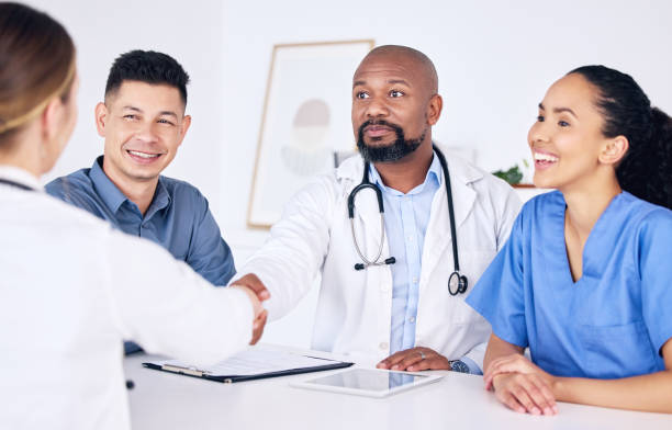 istock Shot of two doctors shaking hands at a clinic 1370901205