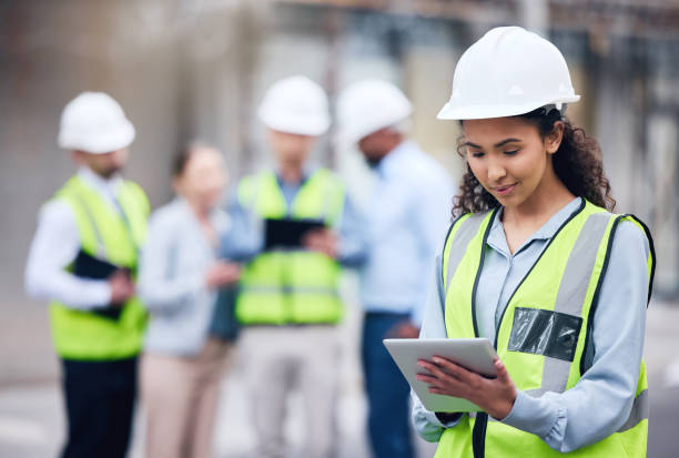 istock Shot of a young female architect using a digital tablet at a building site 1370901231
