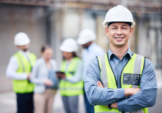 Shot of a mature male architect standing with his arms crossed at a building site Turning dreams into a reality construction worker stock pictures, royalty-free photos & images