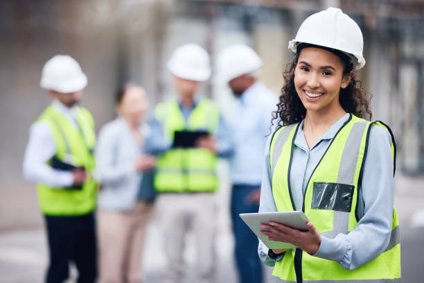 istock Shot of a young female architect using a digital tablet at a building site 1370901240