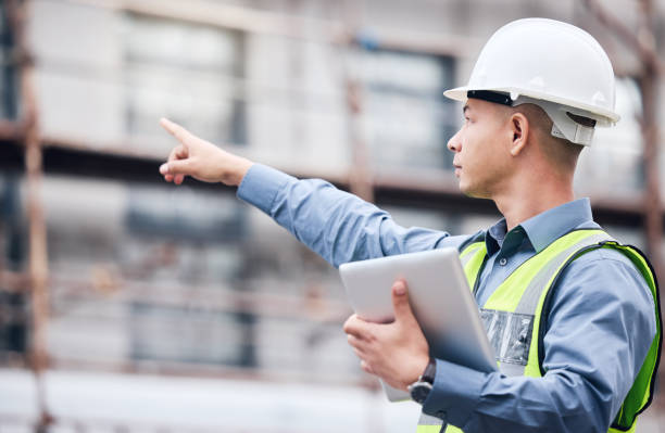 istock Shot of a mature male architect using a digital tablet at a building site 1370901246