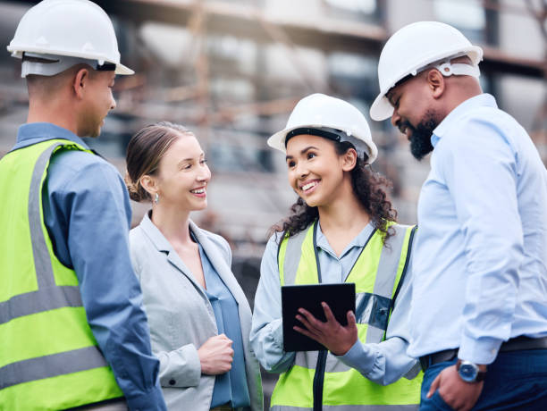 istock Shot of a group of architects using a digital tablet at a building site 1370901266