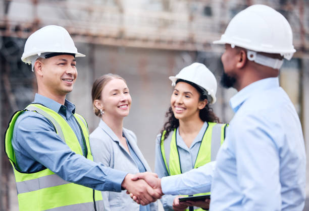 istock Shot of two architects shaking hands at a building site 1370901267