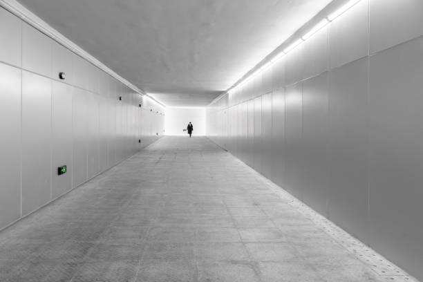 Stockholm, Sweden May 5, 2020 Two men walking in an underground tunnel,