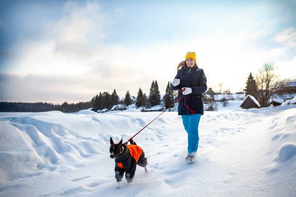 istock Woman walks with dog 1370902563