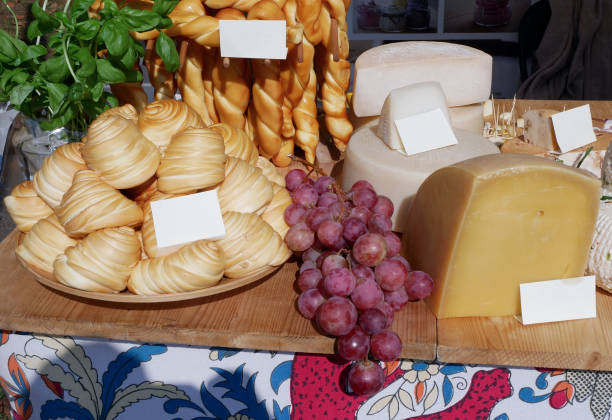 Cheese and grapes on the table for sale