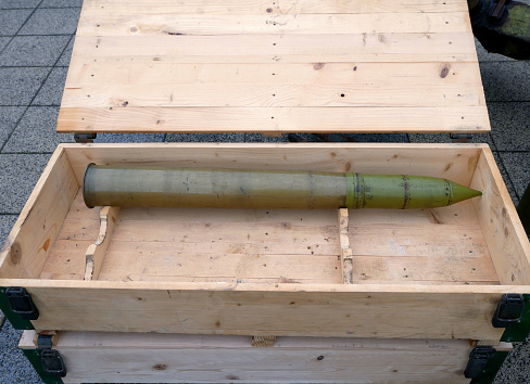 Large bullet in a wooden box
