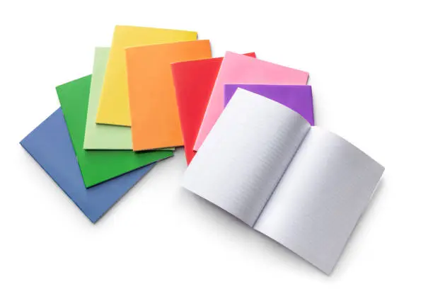 Photo of Office Supplies: Rainbow Colorer Workbooks Isolated on White Background