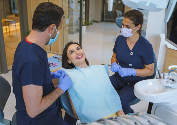 Medical dentist team working in the dental clinic stock photo