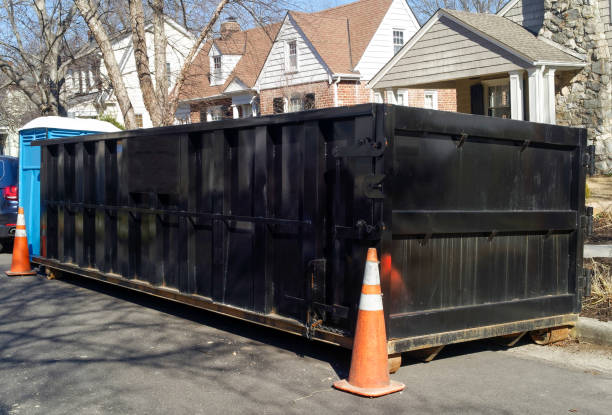 Black industrial dumpster Black industrial dumpster container on neighborhood street. industrial garbage bin photos stock pictures, royalty-free photos & images