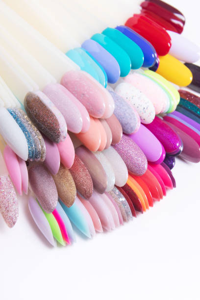 istock Color palette with nail gel polishes for manicure on a white background.. Vertical format. 1370906436
