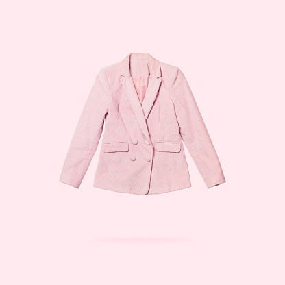 Womens fashionable flying pink blazer isolated on light pink background. Female fashion, stylish fabric jacket. Creative clothing concept. Spring clothes. Single piece of wardrobe, sale, discounts.