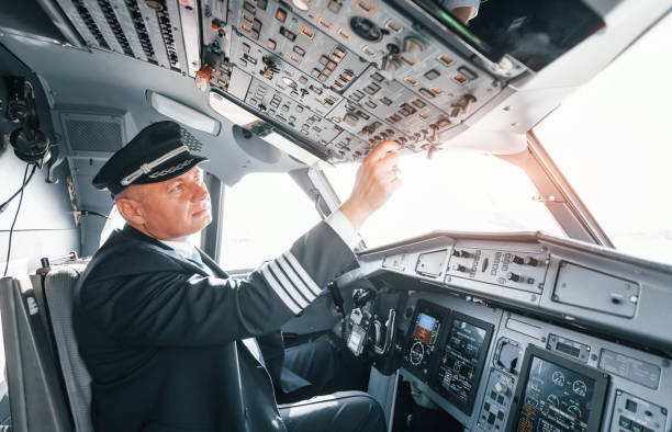 istock A professional pilot is in the cockpit. Conception of work 1370909490