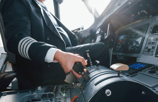 istock A professional pilot is in the cockpit. Conception of work 1370909493