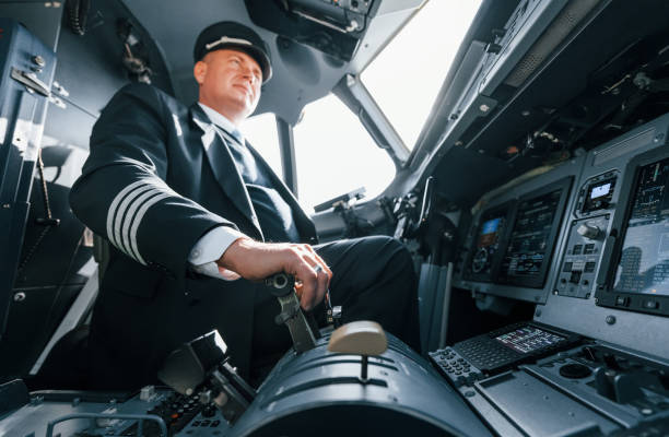 istock A professional pilot is in the cockpit. Conception of work 1370909495