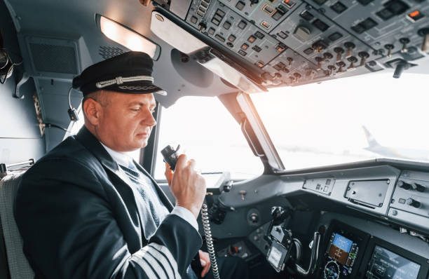 istock A professional pilot is in the cockpit. Conception of work 1370909505