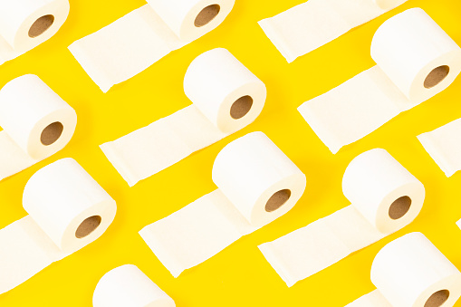 toilet papers on yellow background