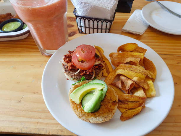 istock Healthy burger with avocado and tomato with fried banana 1370911043