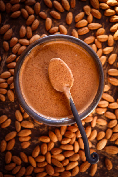 istock Almond butter with whole raw almonds 1370911733