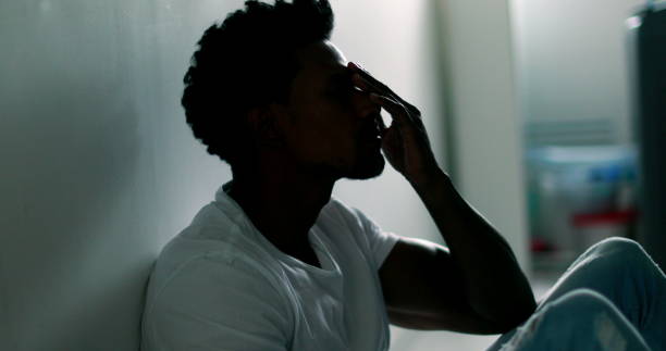 istock Black African american man suffering from mental illness 1370912694